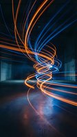 Glowing neon light trails in orange and blue swirl through an industrial concrete space, creating dynamic motion and energy effects for technology, innovation, and modern design projects.