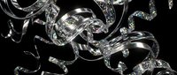 Sparkling silver ribbons with diamond glitter swirl elegantly against a dark background, evoking luxury, celebration, and festive glamour.