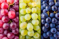 Fresh red, green and purple grape varieties in vertical stripes composition showing juicy ripe fruit clusters close up, natural healthy food background pattern.
