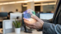 Businessman holding glowing digital globe with network connections in modern office environment, representing global business, technology innovation, and international corporate communication.