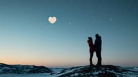 Silhouette of romantic couple standing on snowy mountain peak at dusk with heart-shaped moon in starry winter sky, capturing magical moment of love.
