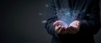 Businessman holding glowing digital network connection in cupped hands against dark background for technology and connectivity concepts.