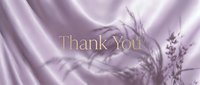 Elegant Thank You text in gold on soft lavender silk fabric with delicate botanical shadows, perfect for greeting cards and luxury branding.