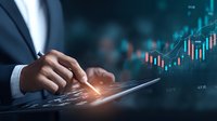 Businessman analyzing financial market data on digital tablet with stock charts and graphs in background, showcasing investment strategy and trading analytics.