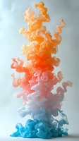 Vibrant colored ink or paint swirling upward in water creating abstract fluid motion with orange, pink and blue gradient effects for creative design projects.