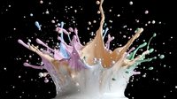 Colorful liquid crown splash with pink, blue, beige and mint green paint drops frozen in motion against black background, high-speed photography effect.