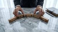 Business professional arranging wooden blocks spelling START PLAN WORK CHECK WIN on marble desk, strategic planning and goal achievement concept for success.