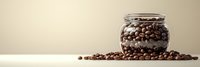 Roasted coffee beans spilling from glass jar on neutral background with copy space, minimalist food composition for cafe and restaurant marketing.