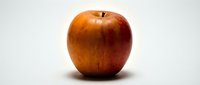 Fresh red apple isolated on white background, suitable for healthy eating, nutrition, and food packaging design projects.