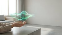Hands presenting glowing green energy waves in modern minimalist living room interior with natural light for technology and innovation concepts.