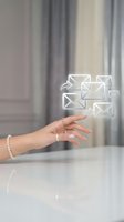 Woman's hand with manicured nails and pearl bracelet touching glowing email icons with arrows, representing digital communication, messaging, and business correspondence.