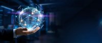 Businessman hand holding glowing digital globe with network connections, representing global communication, technology innovation, and worldwide business connectivity in modern corporate environment.