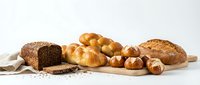 Assorted fresh baked bread loaves and rolls arranged on wooden board against white background, ready for bakery, food service, or culinary design projects.