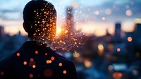 Silhouette of man against urban sunset with magical glowing particles and bokeh lights creating dreamy atmospheric overlay effect for creative photography.