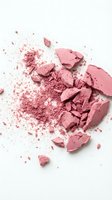 Crushed pink powder and broken makeup chunks scattered on white background, suitable for cosmetics, beauty, and skincare product advertising.