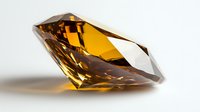 Amber colored gemstone with brilliant facets casting shadows on white surface, luxury jewelry element photographed in macro with soft lighting and reflection.