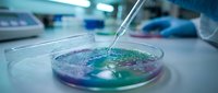 Laboratory pipette dispensing liquid into petri dish with colorful solution for scientific research and chemical analysis experiments.