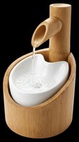 Bamboo water fountain with ceramic basin, isolated on transparent background, ready for design use on t-shirts, stickers, clipart, and print-on-demand products.