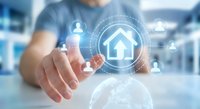 Businessman touching digital home icon with network connections for smart house technology and real estate services in modern office environment.