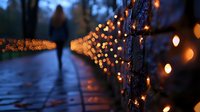 Atmospheric evening scene with glowing string lights along wet pathway and silhouetted figure walking in distance, creating moody bokeh effect and reflections.