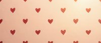 Seamless pattern of scattered red hearts on warm beige background, tiles continuously for wallpaper, textiles, wrapping paper and romantic design projects.