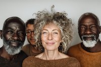 Diverse group of senior adults with natural gray hair and beards smiling at camera, representing friendship, diversity, and aging gracefully.
