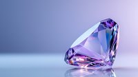 Pink diamond with brilliant cut on soft purple background, luxury gemstone with sparkle and reflection showing facets and clarity in close up macro photography.