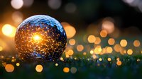 Magical glowing sphere on grass with golden bokeh lights in background creates dreamy atmosphere at dusk, mystical garden scene with orb reflection.