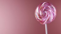 Pink and white spiral lollipop on pink background, minimalist candy composition with swirling pattern and stick, sweet treat with copy space for design projects.