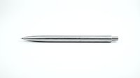 Sleek silver ballpoint pen isolated on white background, ready for design use on stationery, office supplies, and promotional materials.