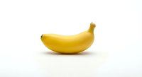 Single ripe yellow banana isolated on white background for healthy eating, nutrition concepts, cooking ingredients and tropical fruit designs.