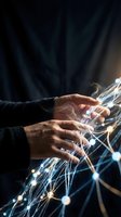 Person with medium skin tone wearing dark clothing interacting with glowing digital network lines and connected nodes, representing technology, data connectivity, and digital transformation for business and innovation concepts.