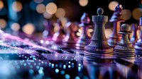 Chess pieces on reflective surface with purple and blue lighting effects and bokeh background create dramatic atmosphere for strategy and leadership concepts.