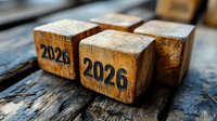 Rustic wooden blocks displaying number 2026 on weathered wood surface with dramatic lighting and shallow depth of field, symbolizing future planning.