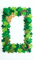 Festive rectangular frame made with green shamrock clovers, lucky horseshoes, gold coins, and leprechaun hats on white background for St. Patrick's Day celebrations.