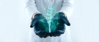 Medical professional in lab coat holding glowing digital lungs hologram in cupped hands representing respiratory health technology and healthcare innovation.