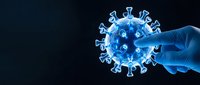 Medical professional in blue gloves holding coronavirus model for healthcare education and virus research on dark background.