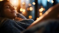 Young woman relaxing with eyes closed in cozy evening atmosphere with warm bokeh lights, expressing serenity and mindfulness. Peaceful moment at home.