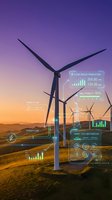 Wind turbines at sunset with glowing digital HUD overlays showing energy output, grid stability, and smart tech integration data panels.