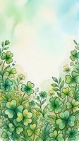 Watercolor shamrock and clover border with soft green tones and copy space, perfect for St. Patrick's Day greeting cards and spring designs.