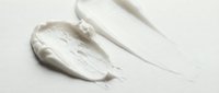 Thick white paint strokes and smears on neutral background, isolated for design projects, packaging, and creative compositions.