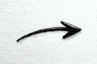 Hand-drawn black arrow pointing right on white textured paper, indicating direction or next step in a process.