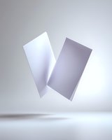 Floating white paper sheets casting soft shadows on light background, minimalist composition with elegant curves and folds for business and design presentations.