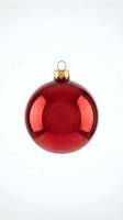 Red Christmas ornament ball with gold cap isolated on white background for holiday decorations and seasonal design projects.
