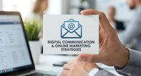 Professional businessman holding white business card with email marketing icon and digital communication strategies text in modern office workspace.