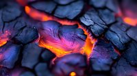 Glowing hot embers with vibrant orange and purple colors between black charcoal pieces create dramatic texture and pattern in extreme macro photography.