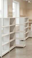 Modern white modular shelving unit with open compartments in bright interior space, suitable for storage solutions, home organization, retail displays, and contemporary furniture design.