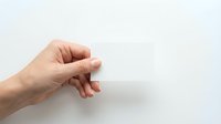 Human hand reaching out with fingers positioned in grasping motion against clean white background, isolated for design use.