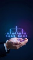 Business professional hands holding glowing organizational chart with network connections on dark blue gradient background for corporate presentations.