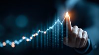 Businessman finger touching glowing financial chart showing growth trend on dark background with bokeh effect, demonstrating business success and analytics.